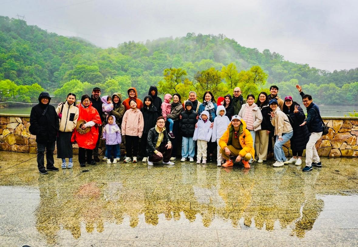 Joann's extended family gathered by a lake in China